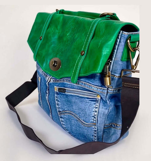 Stylish green leather and denim handbag with a unique design and adjustable strap.